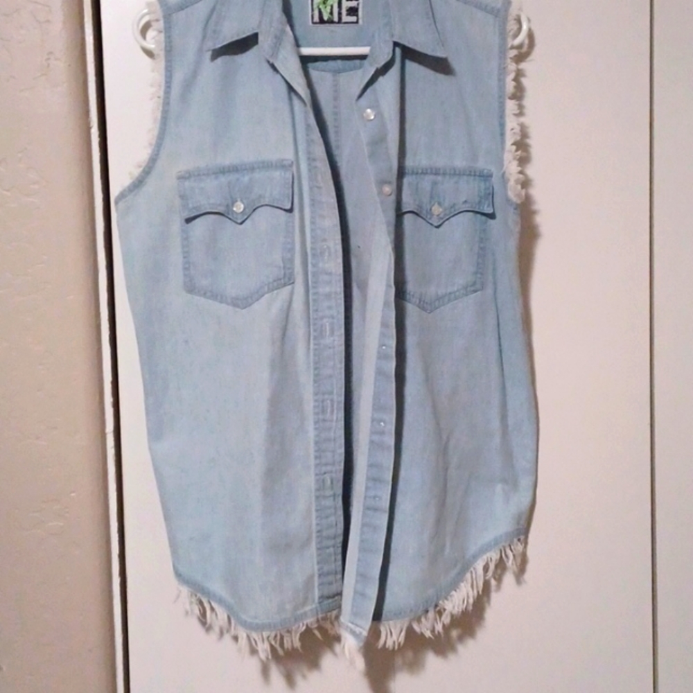 ME Teez sleeveless denim shirt, with fraying around arms and bottom.